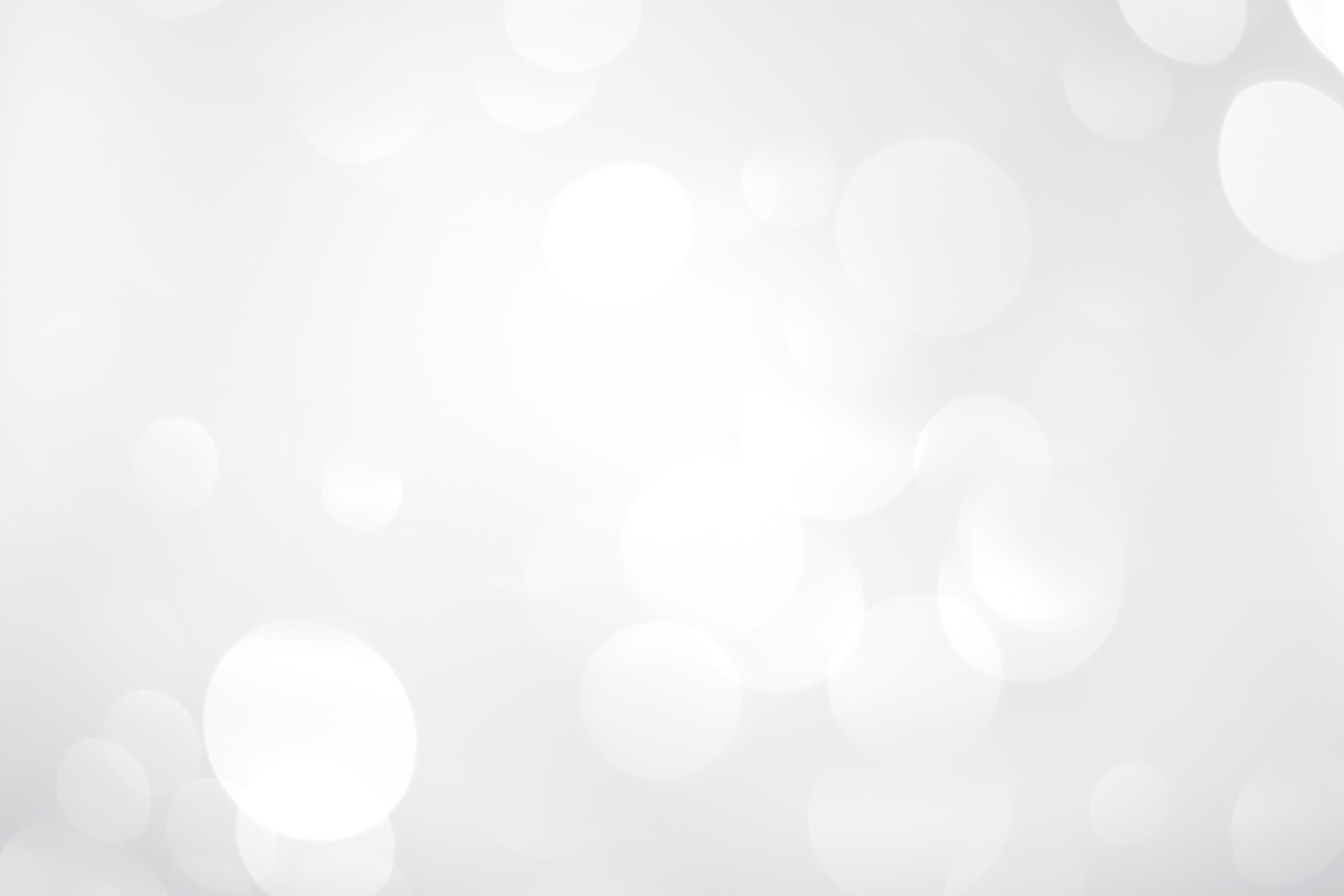 White Snowflakes in Bright Bokeh Background